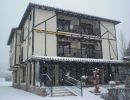 Fachada nevando en Diciembre a Febrero