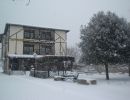 Fachada nevando en Diciembre a Febrero