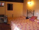 Habitación con tres camas